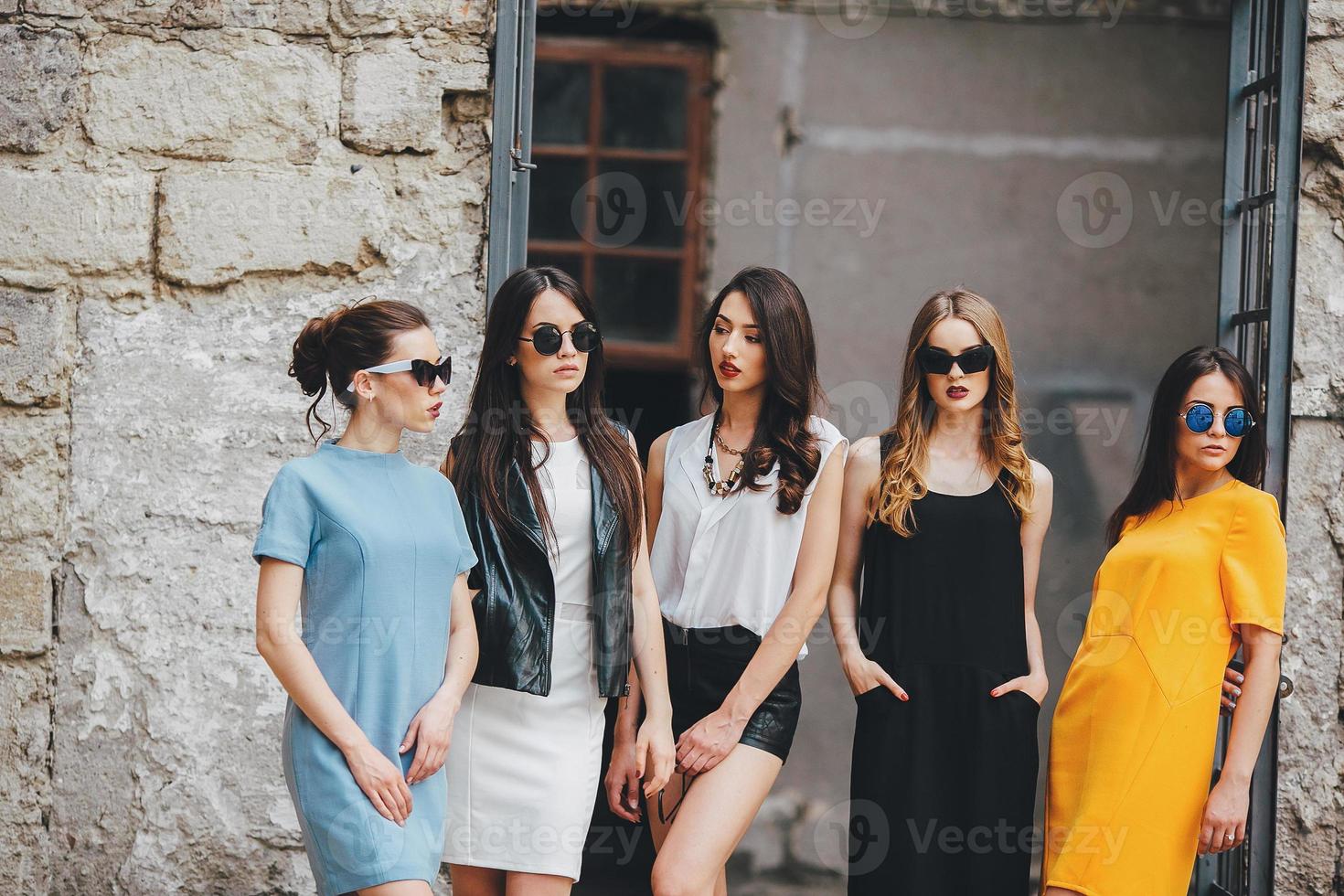 Five young beautiful girls in the city photo