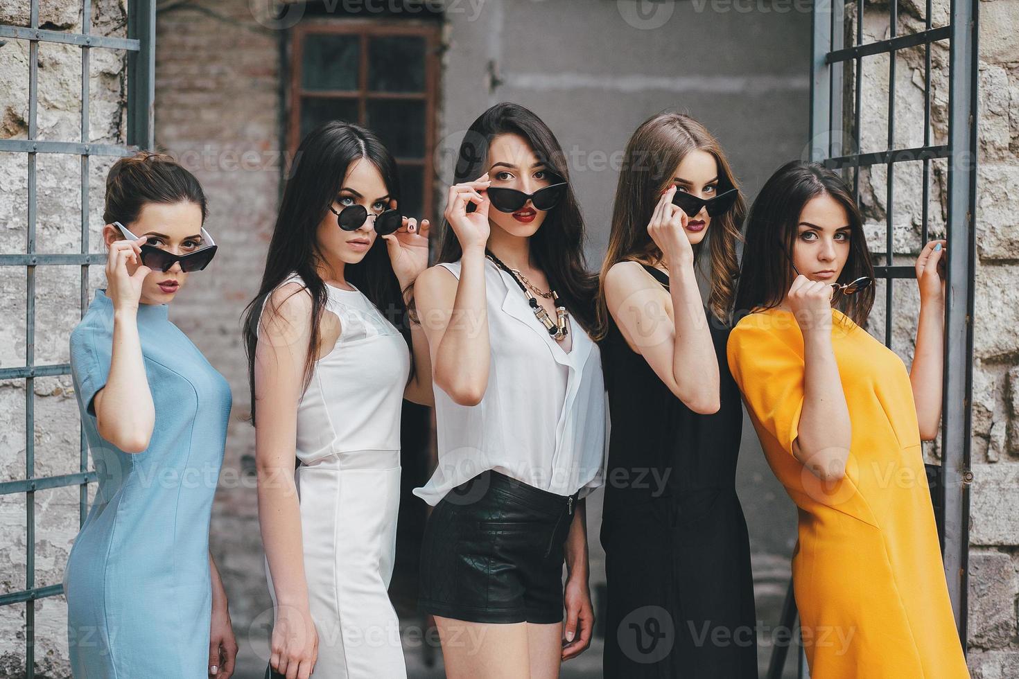 Five young beautiful girls in the city photo