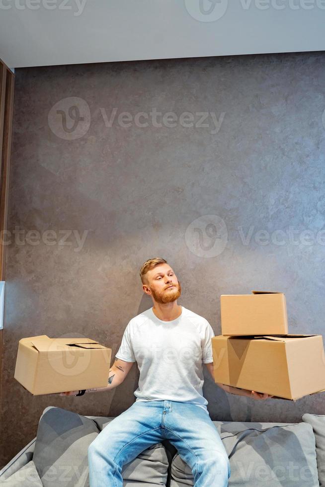 The guy is preparing a few boxes photo