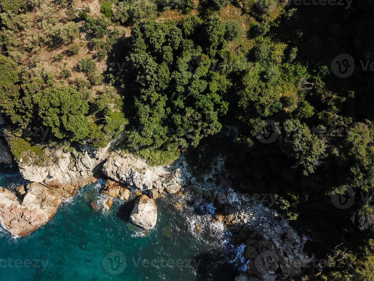 Drone top view of a sea cliff and a beach photo