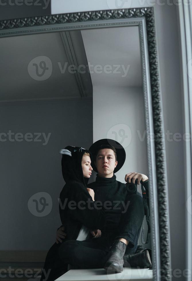 man and woman in black clothes photo