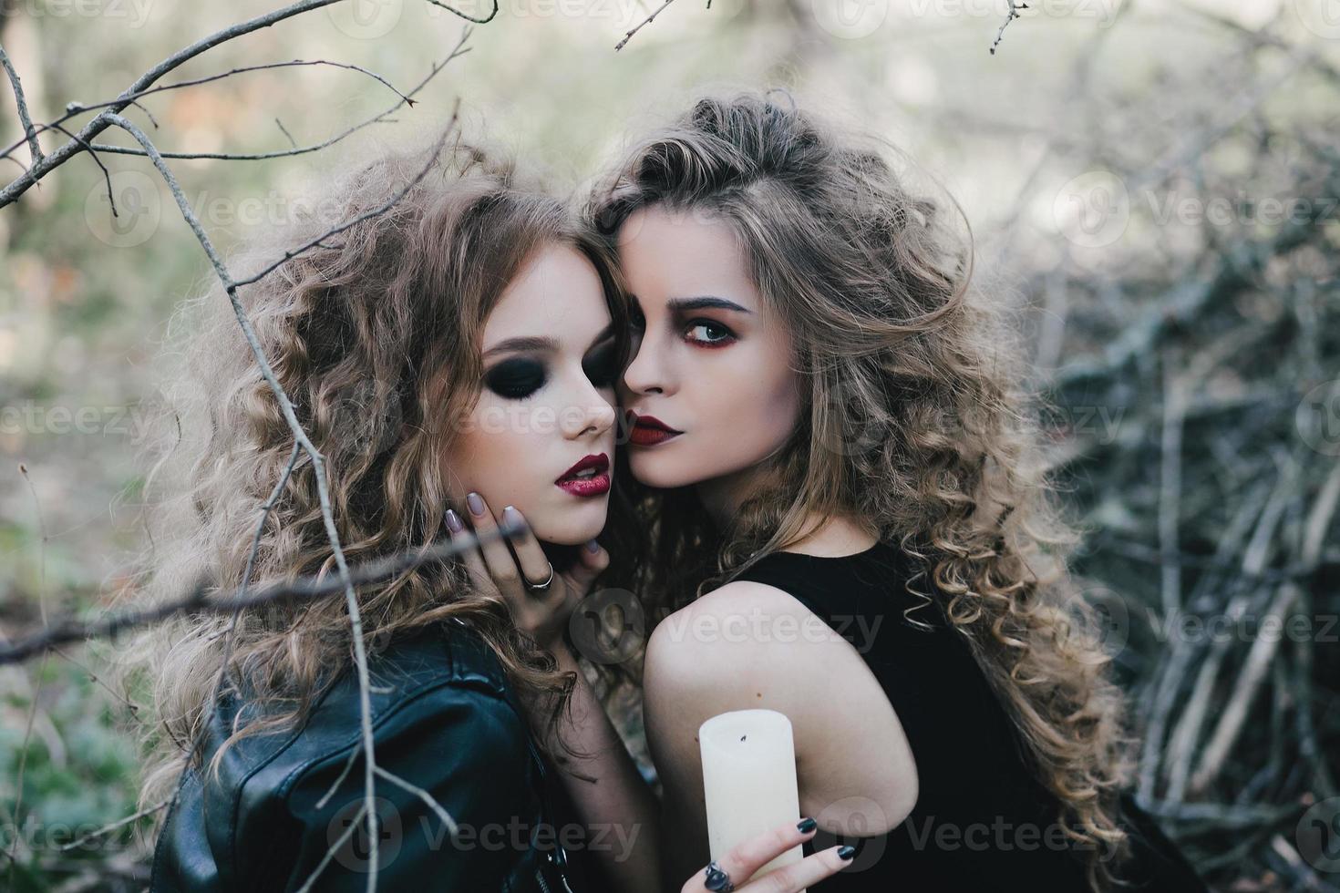 Two vintage witches gathered eve of Halloween photo