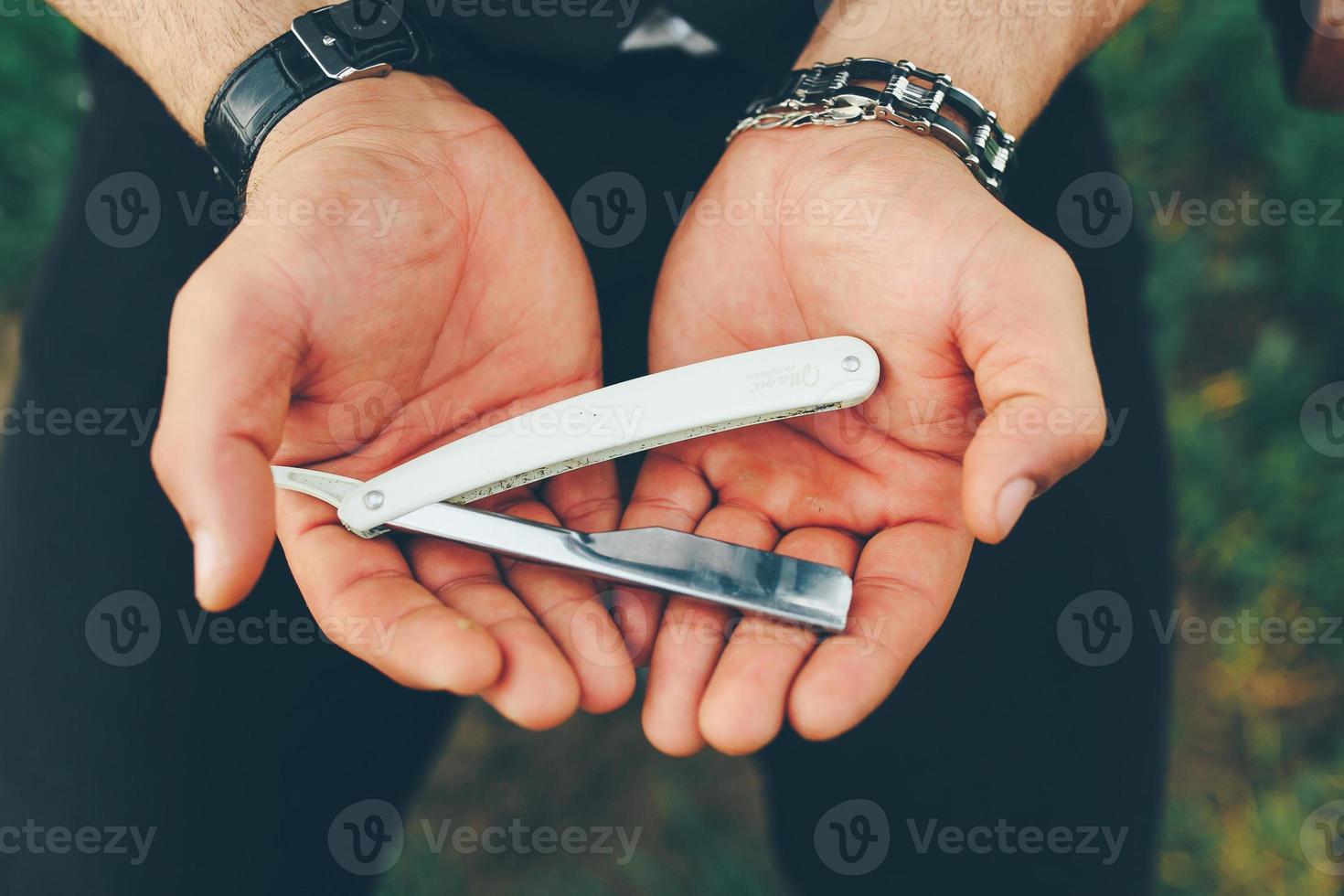 ancient blade in the hands of men photo