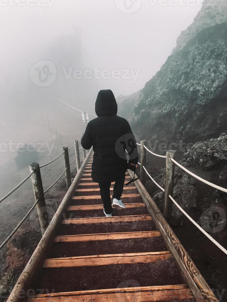 Man on the stairs railing. photo