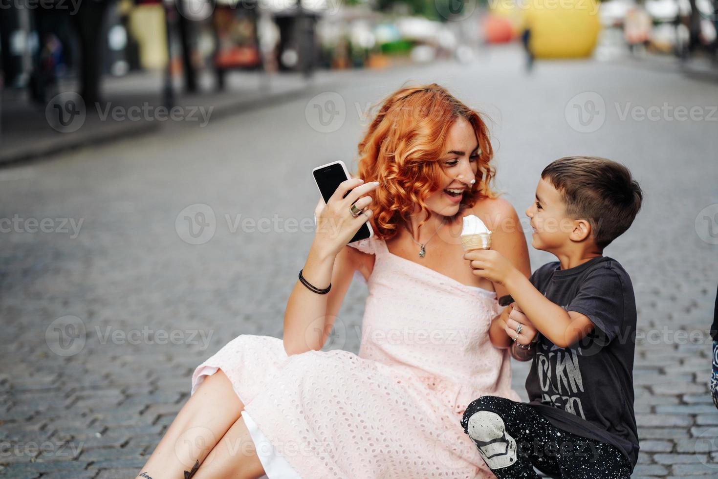 mom and son eat ice cream together photo