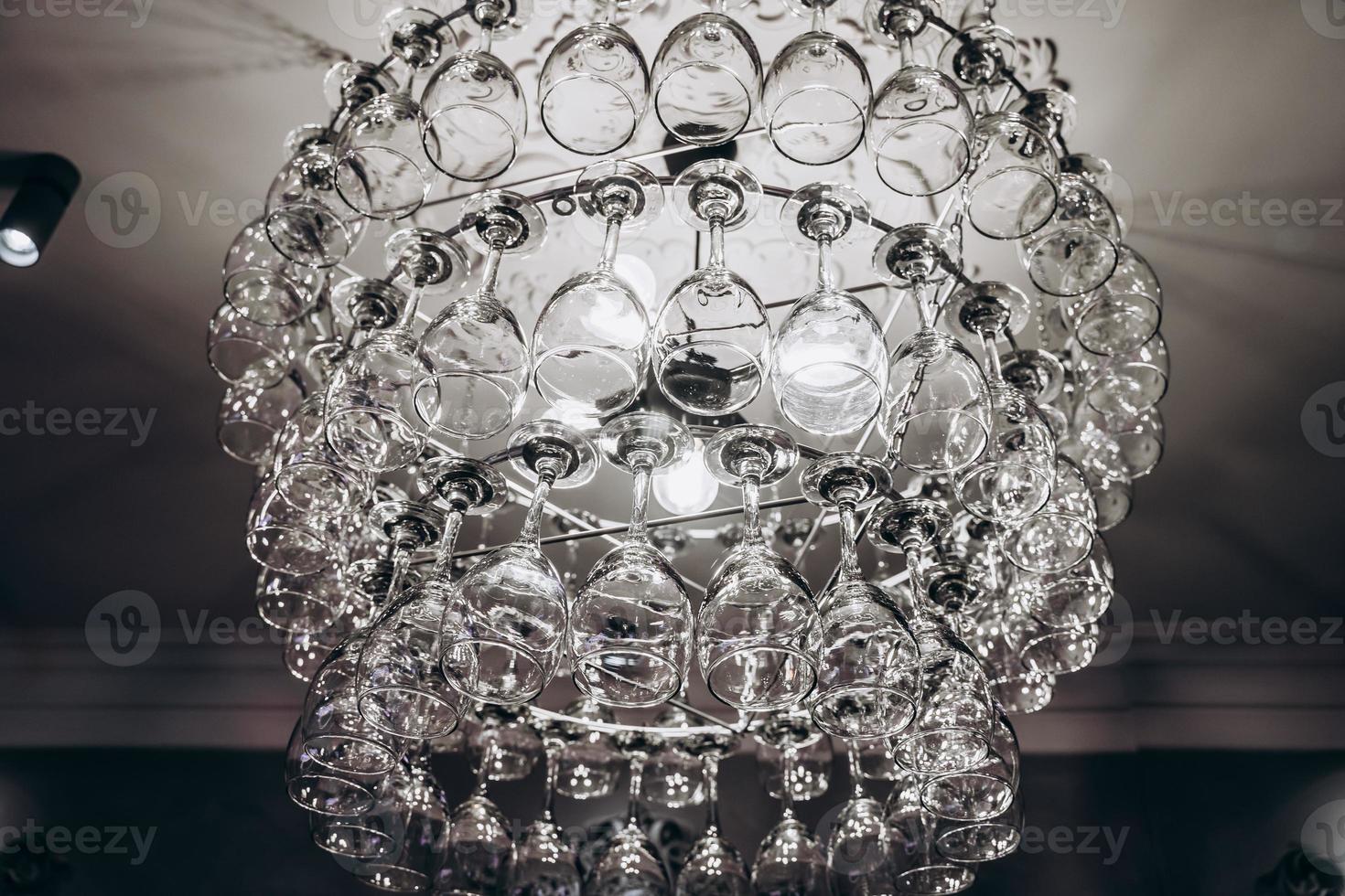 Beautiful chandelier made with glasses of wine photo