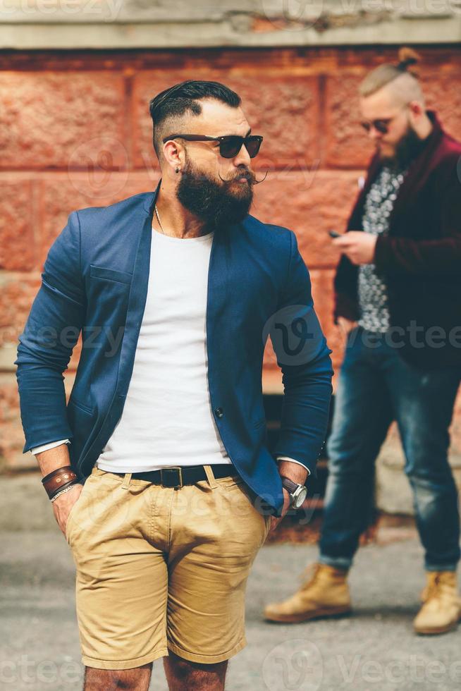 Two stylish bearded men on the background of each other photo