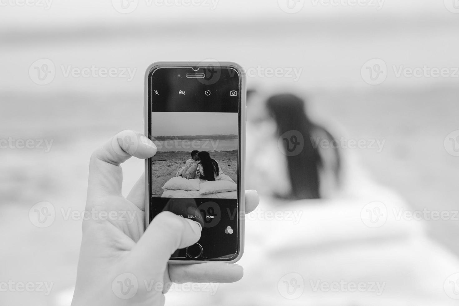 Happy Couple relaxing together on the mattress photo