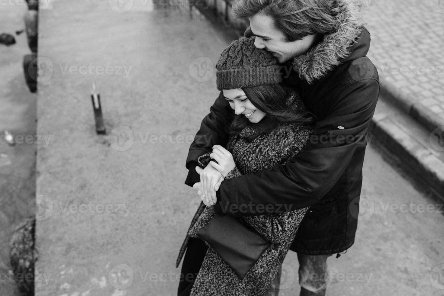 beautiful couple having fun on the pier photo