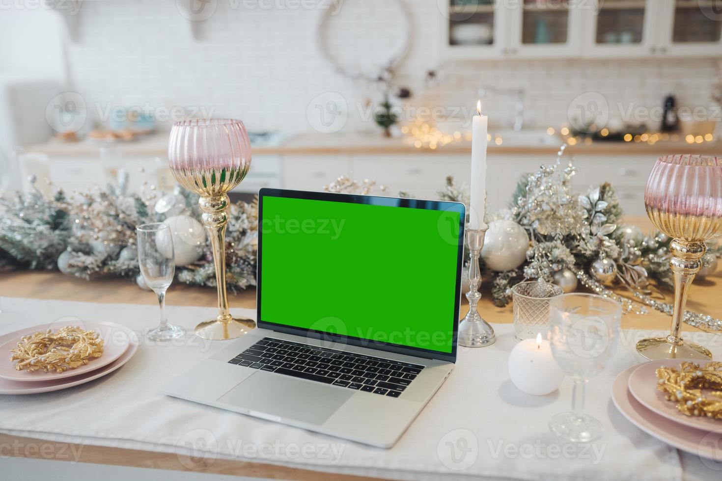 laptop with green screen - chromakey near New Year's decorations. christmas theme. photo