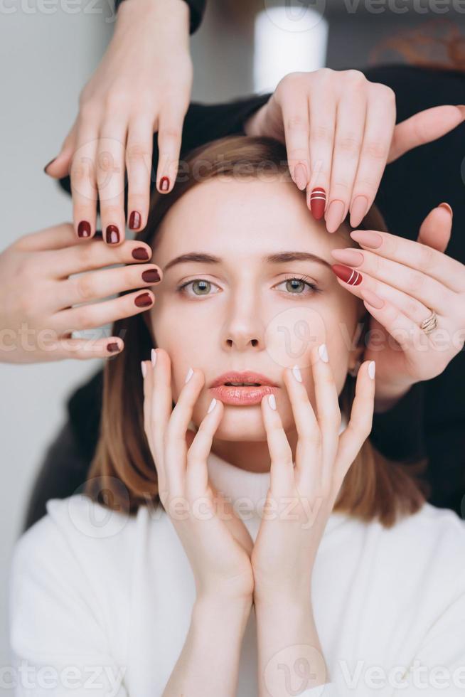 Girl face and hands that make different beauty salon service photo