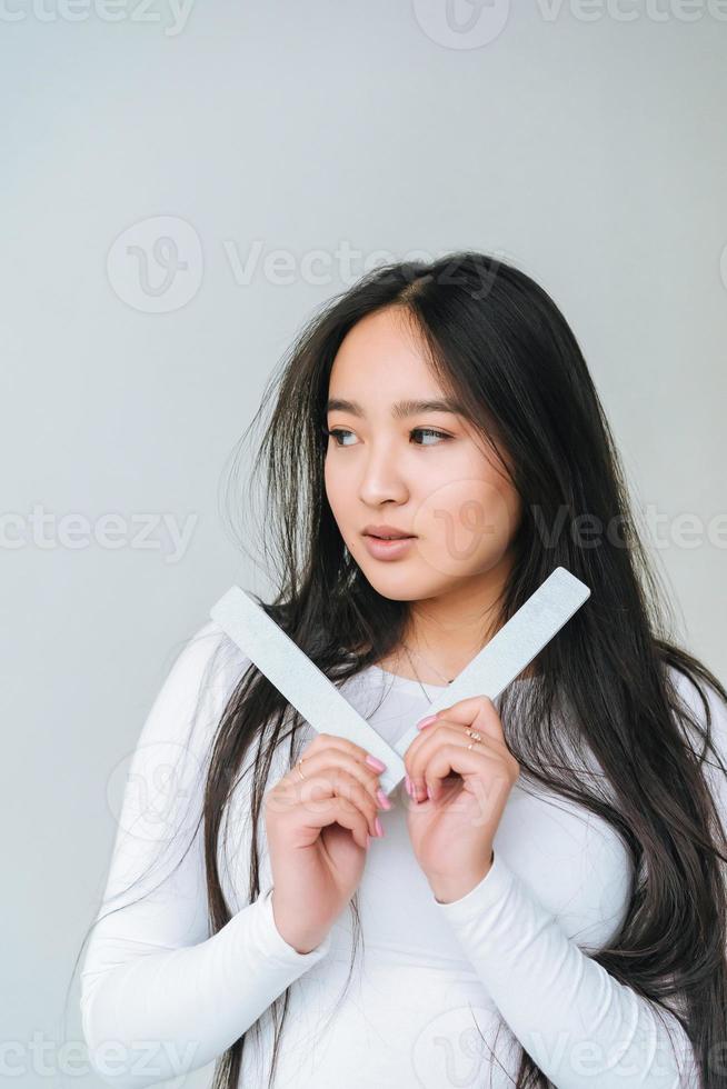 Portrait of a pretty smiling woman posing isolated photo