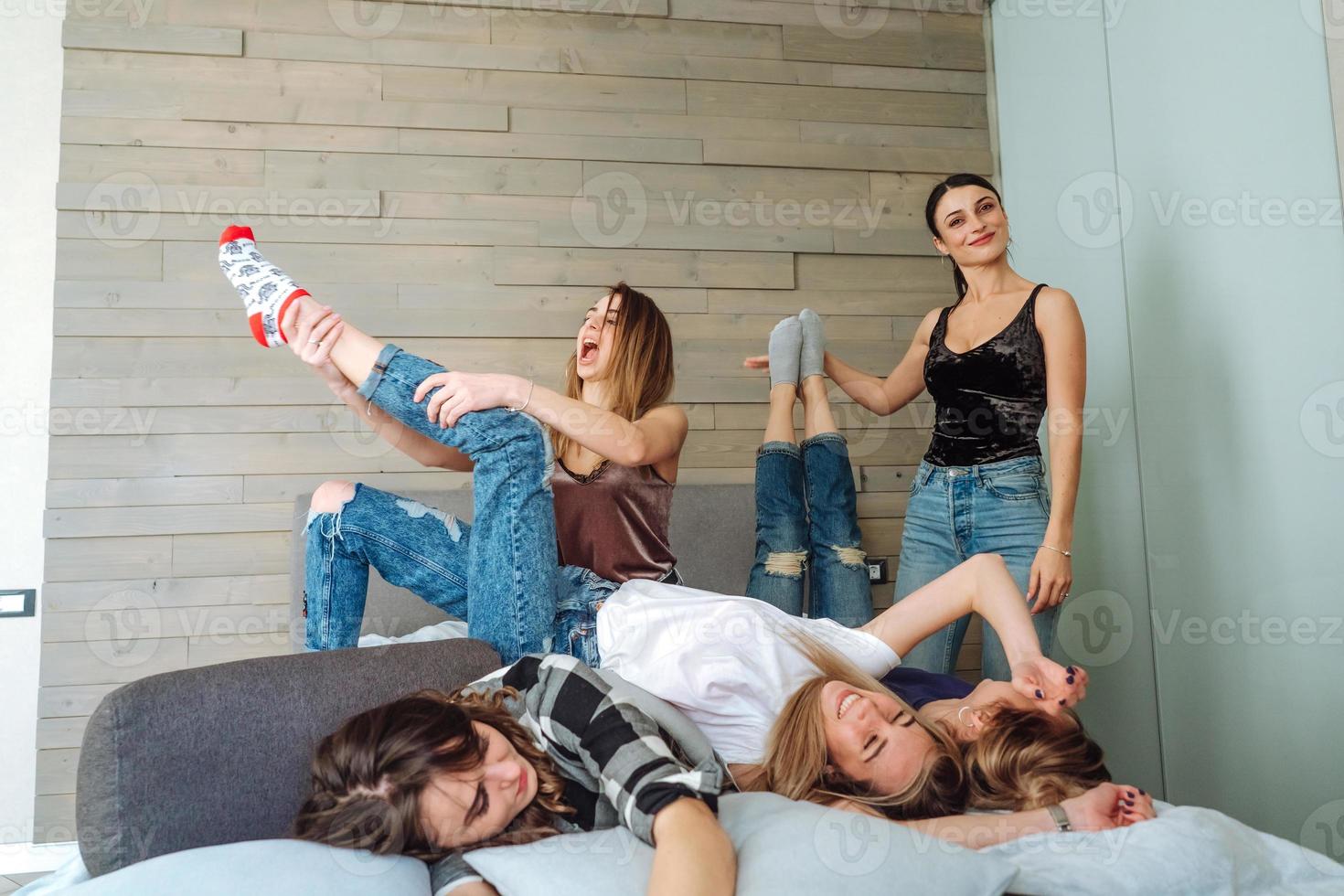 five girls on the bed in the bedroom photo