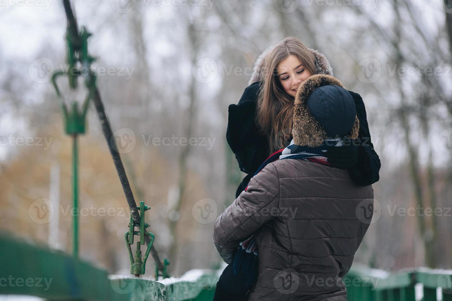 beautiful couple on a bridge photo