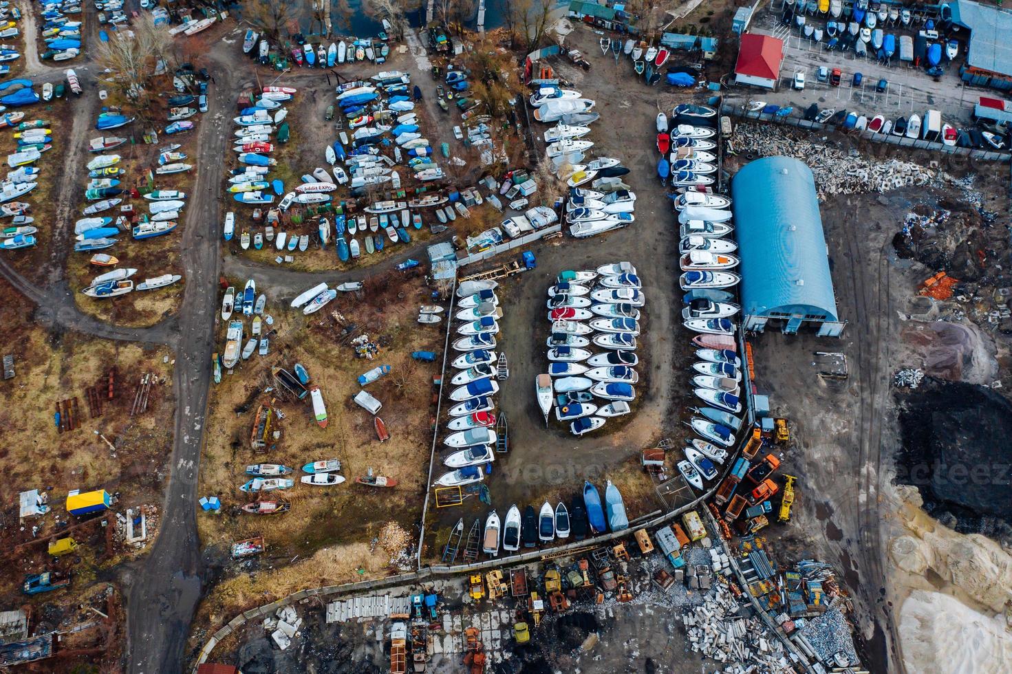 Aerial view of boat yard on land. Stored ships during winter time photo