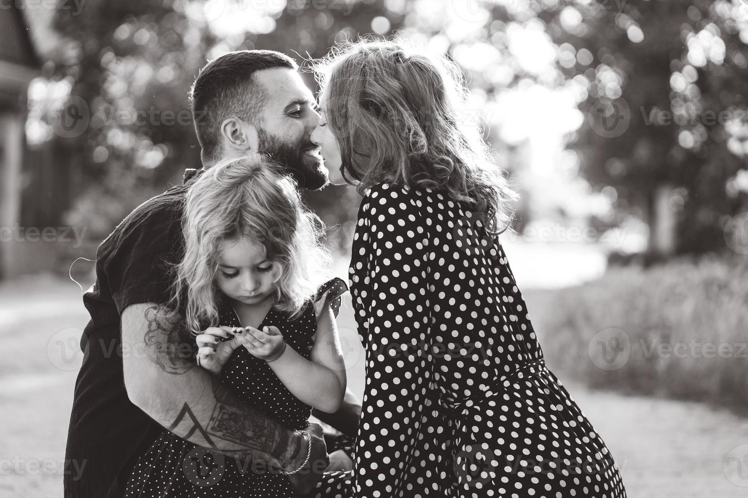 Loving parents walk with their little daughter photo