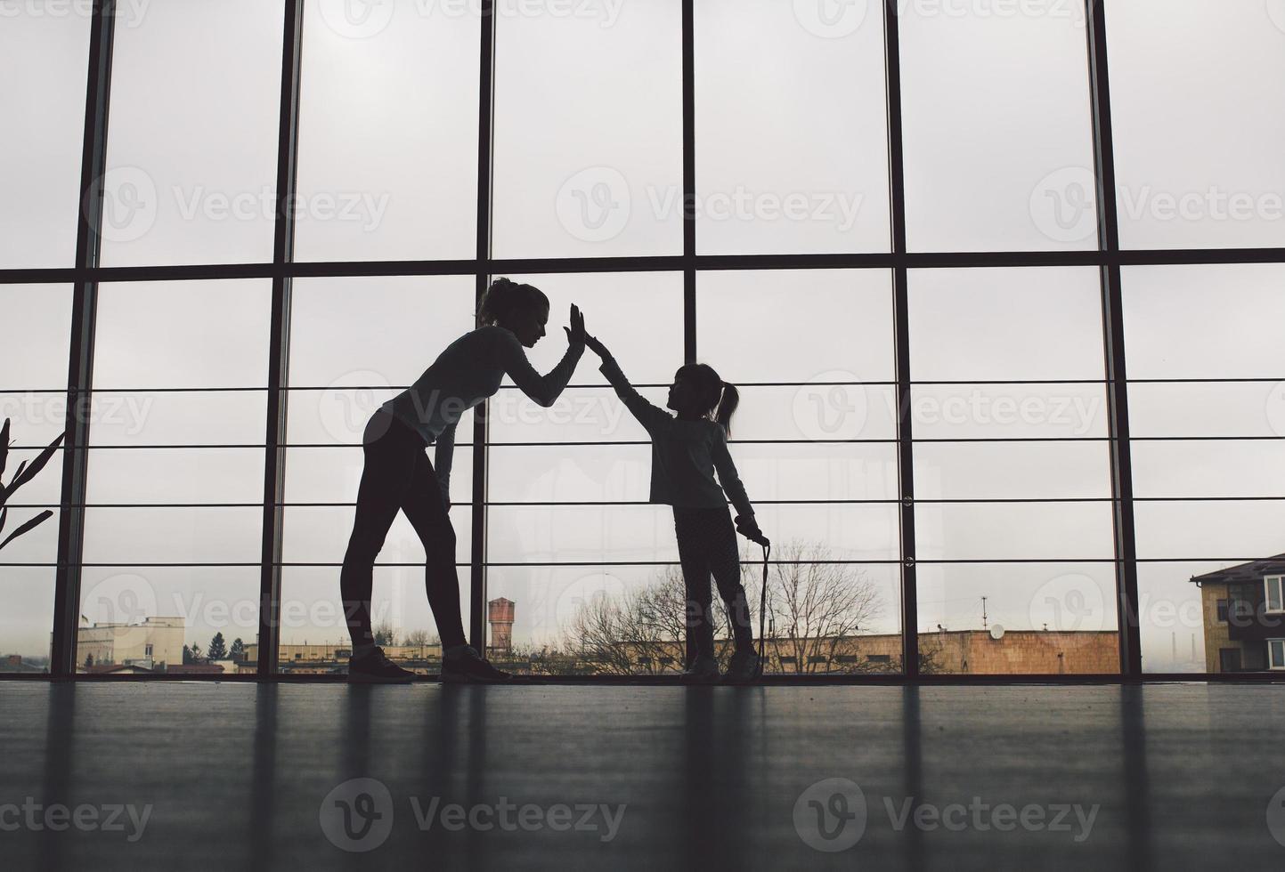 Charming family spends time in the gym photo