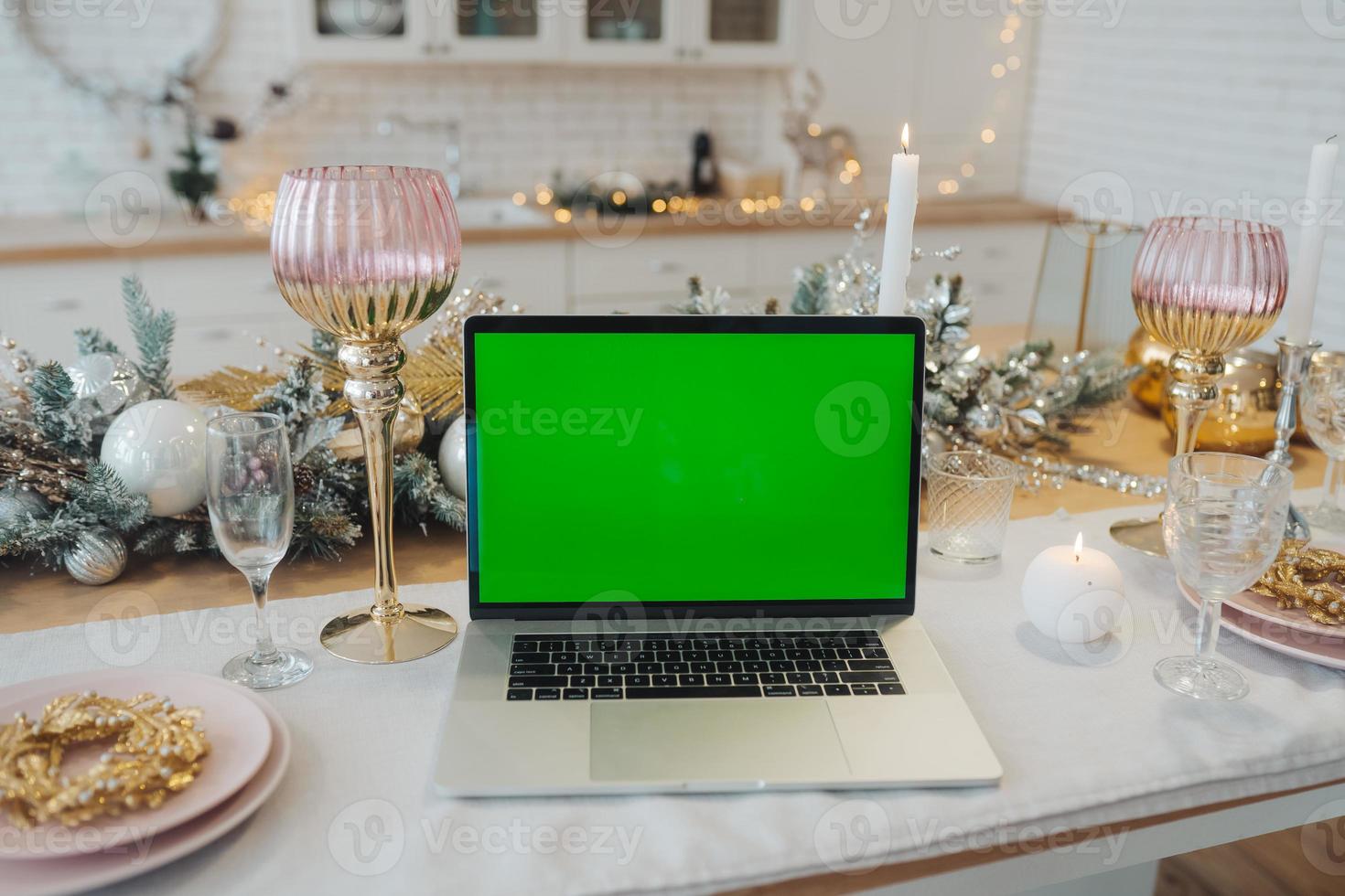 laptop with green screen - chromakey near New Year's decorations. christmas theme. photo