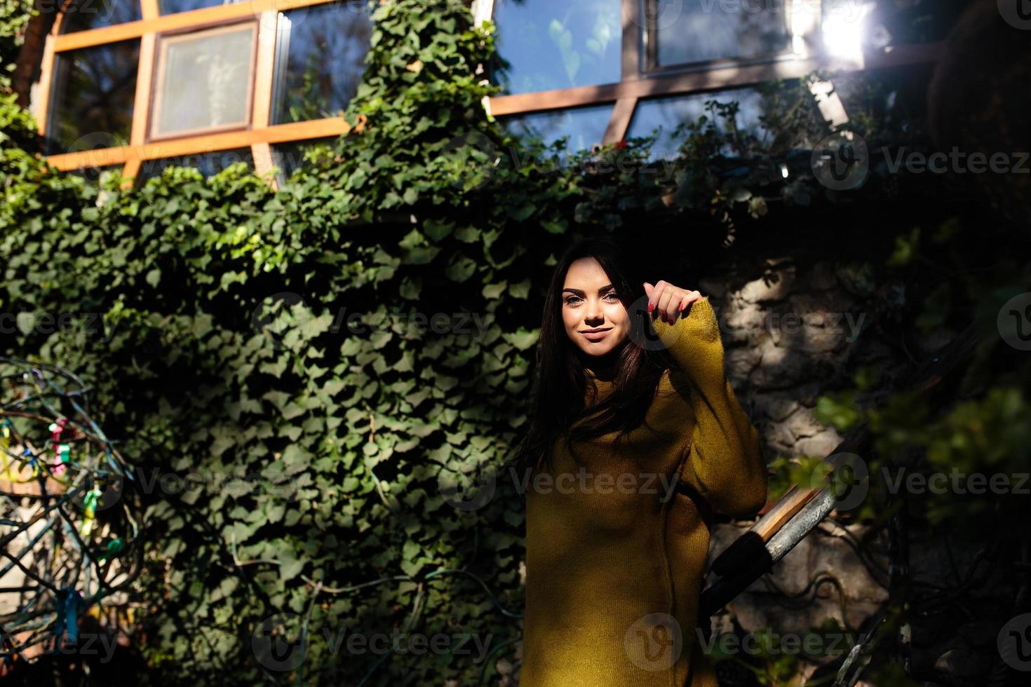 woman posing in the shade of of leaves photo