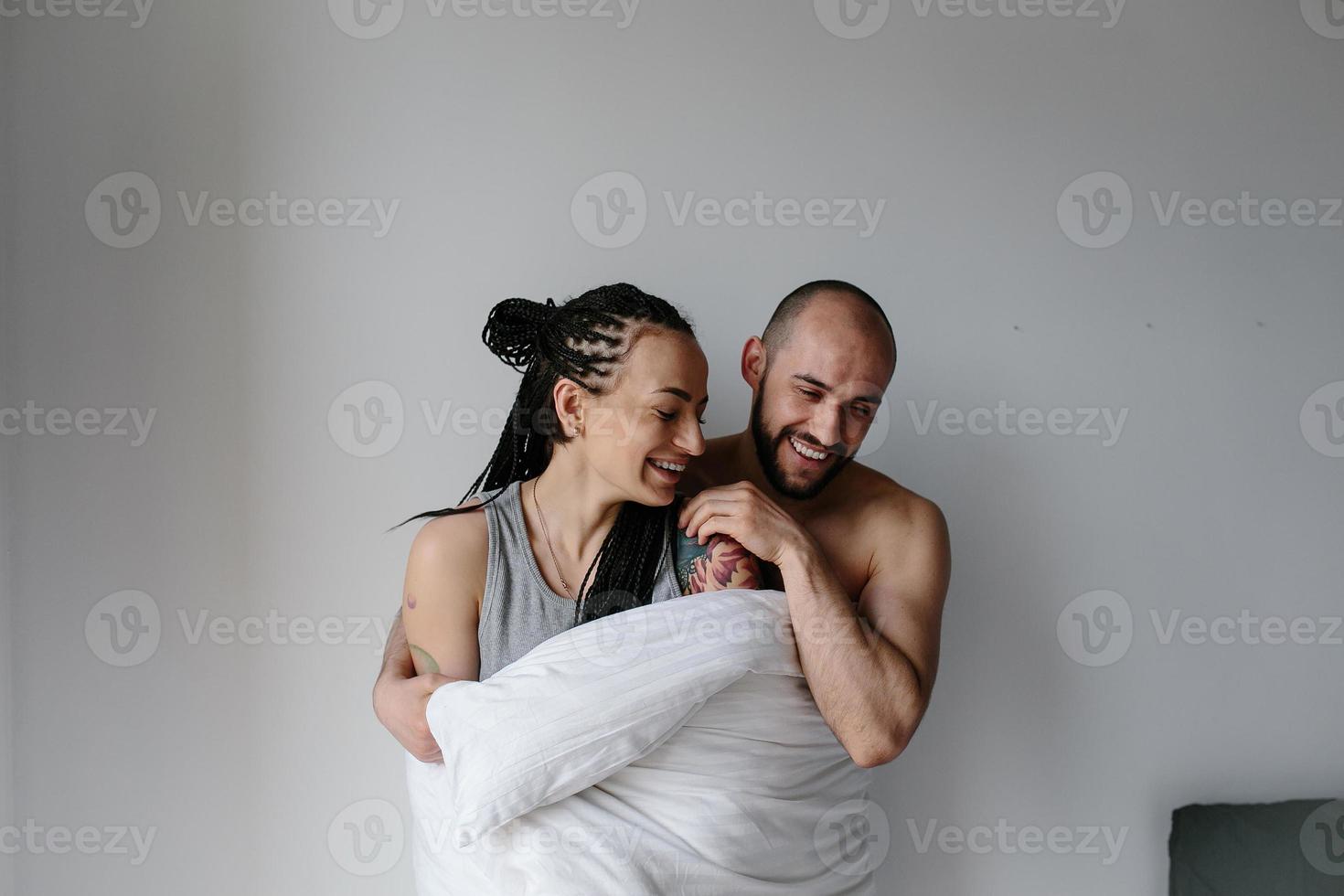 man and woman in the bedroom photo