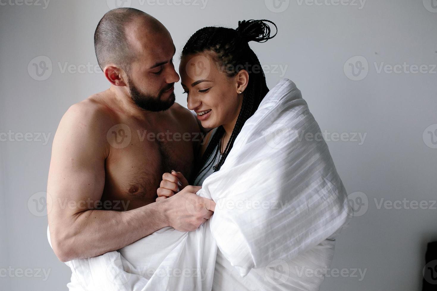 man and woman in the bedroom photo