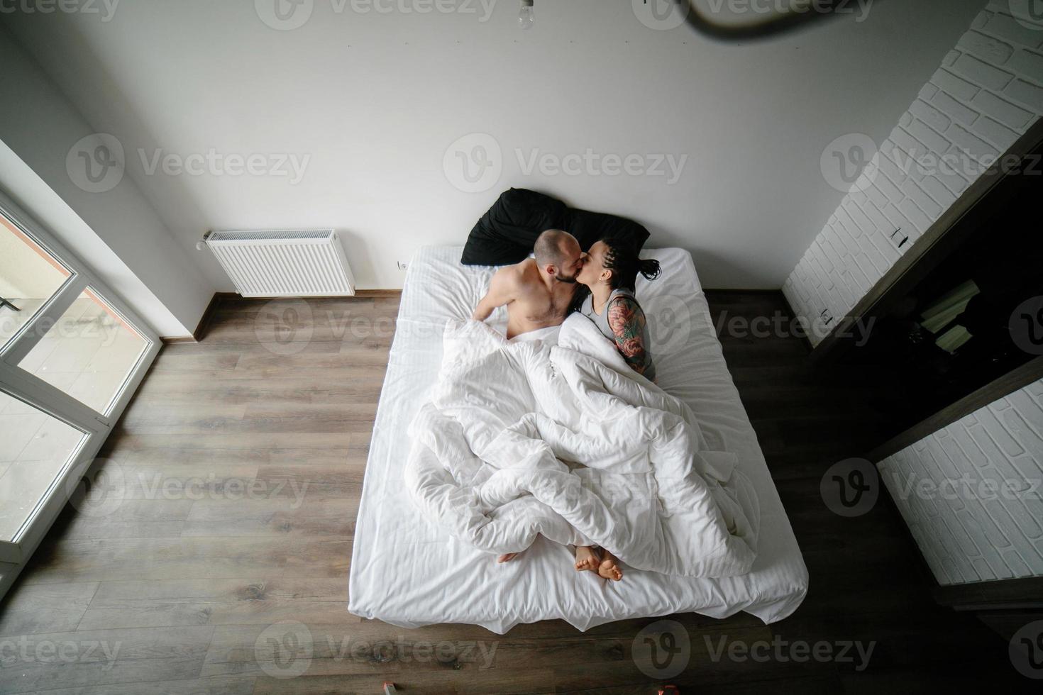 man and woman on the bed photo