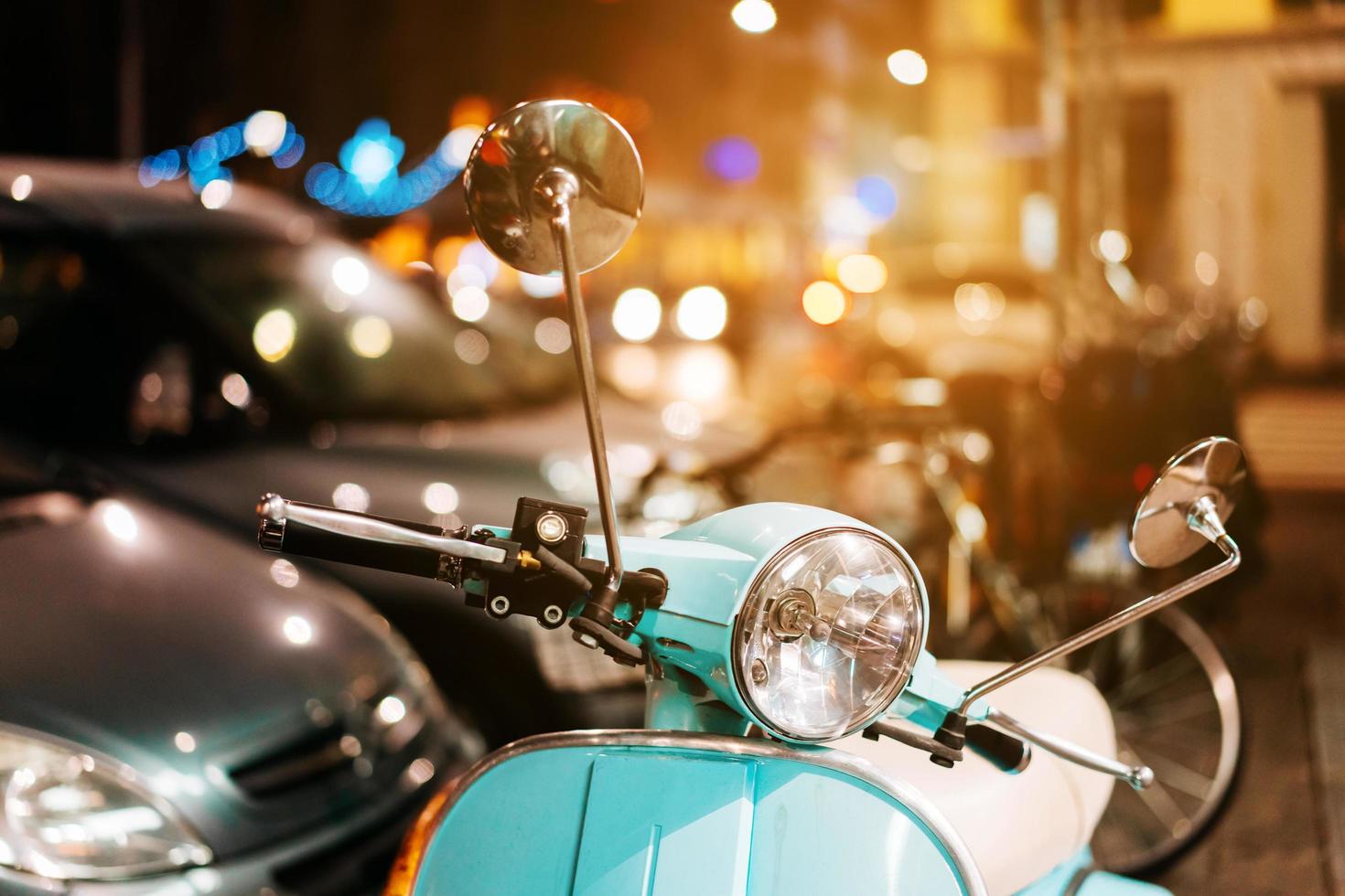 Light blue retro scooter on the street photo