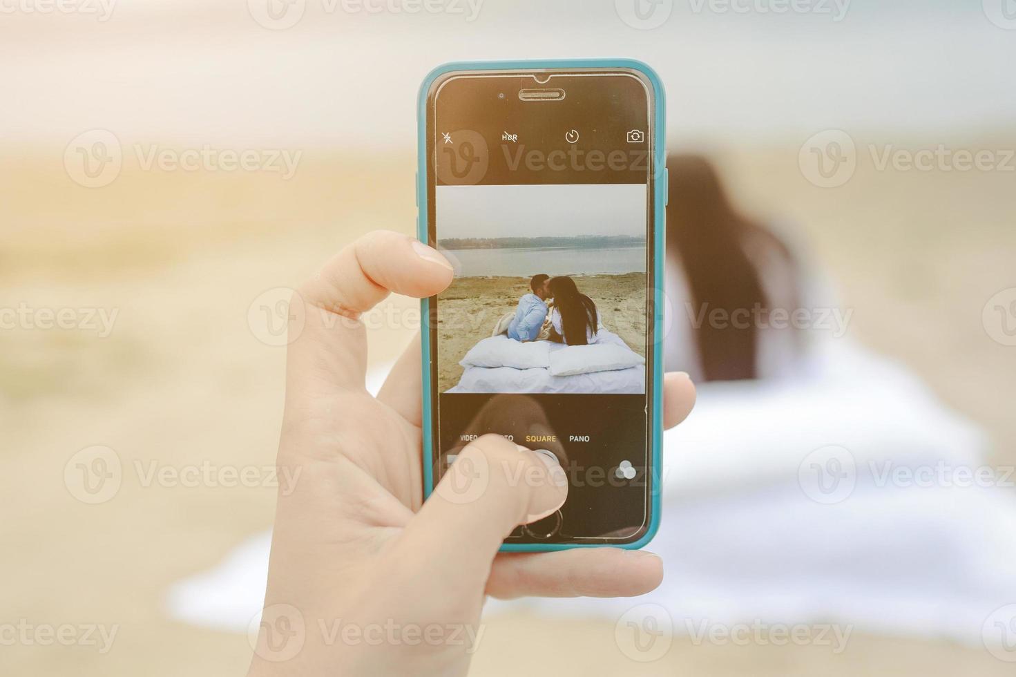 Happy Couple relaxing together on the mattress photo