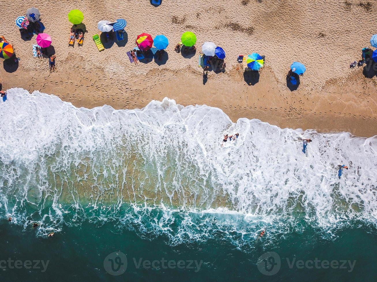 Beach with sun loungers on the coast of the ocean photo