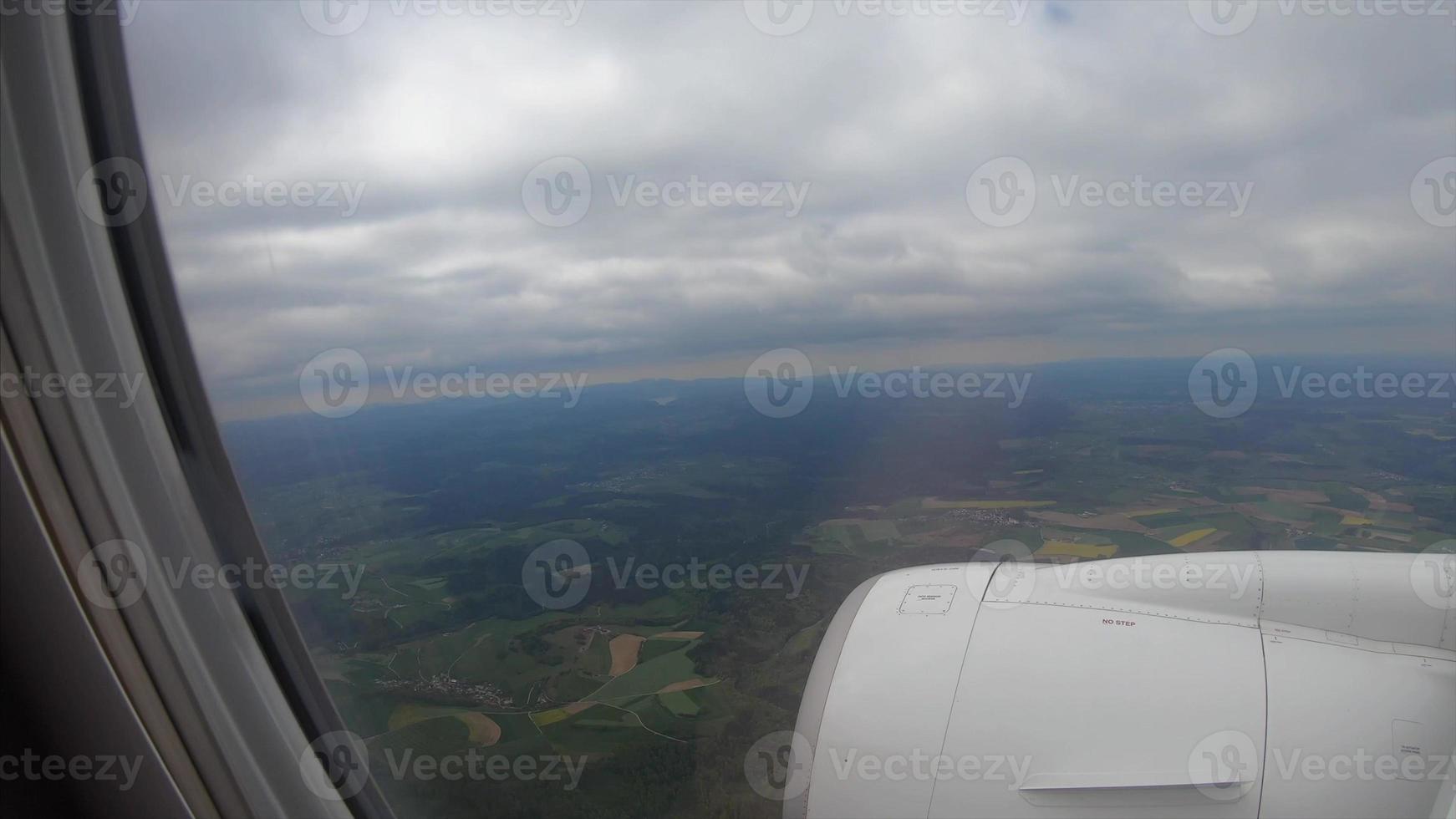 View from the window of a passenger airplane of a landscape photo