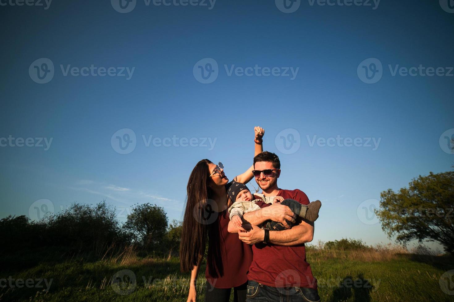 young family with a child on the nature photo