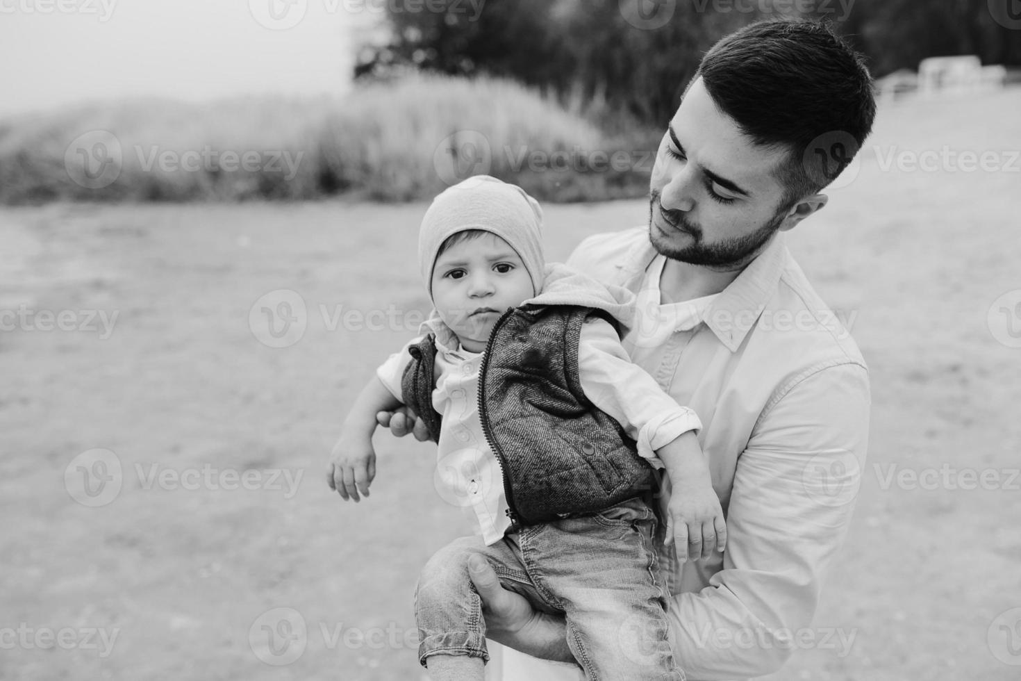 Dad with little son in her arms photo