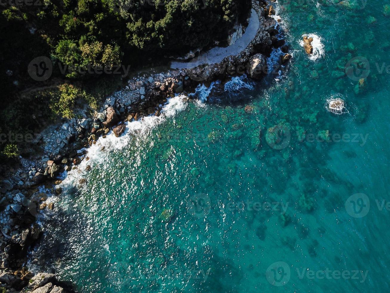 Drone top view of a sea cliff and a beach photo