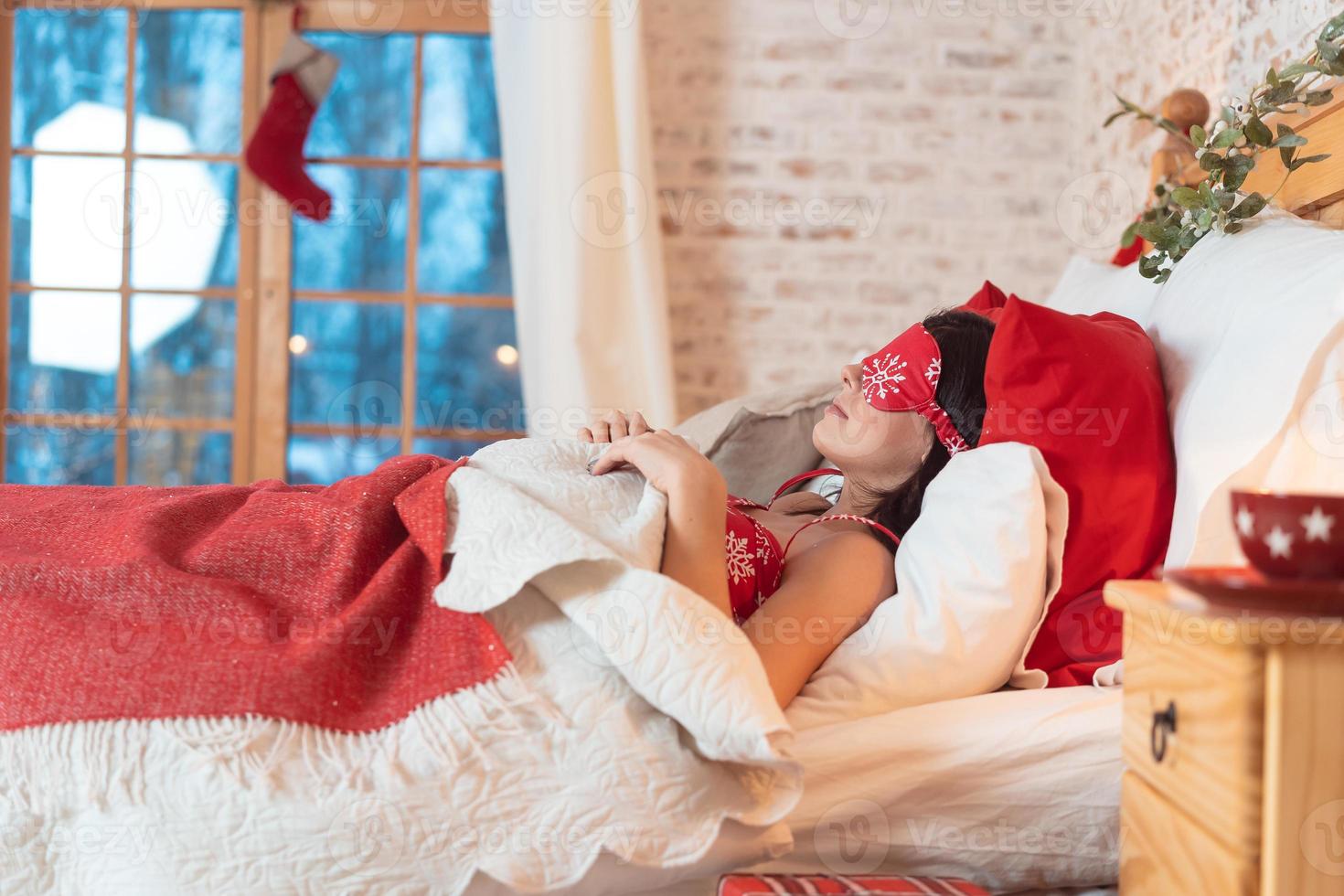 Young beautiful woman sleeping in her bed photo