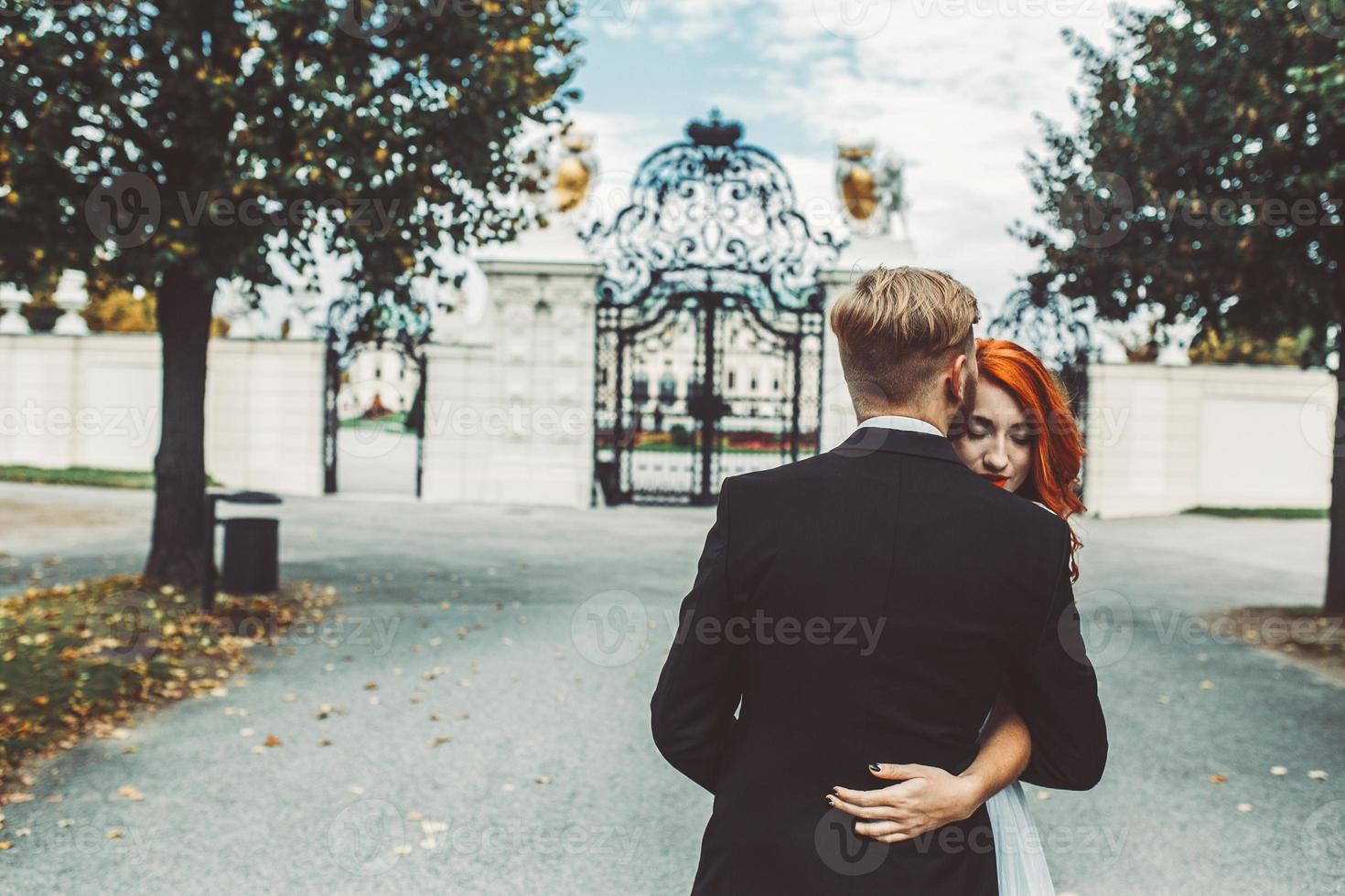 Wedding couple on a walk in the estate of the Belvedere in Vienna photo