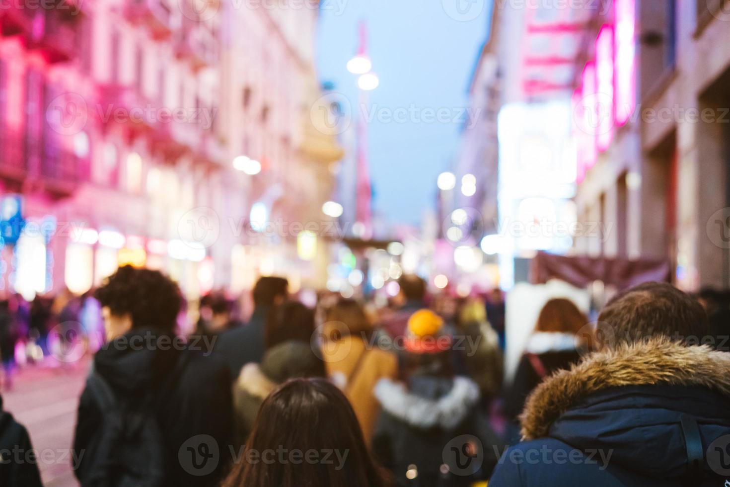 people crowd walking on busy street photo