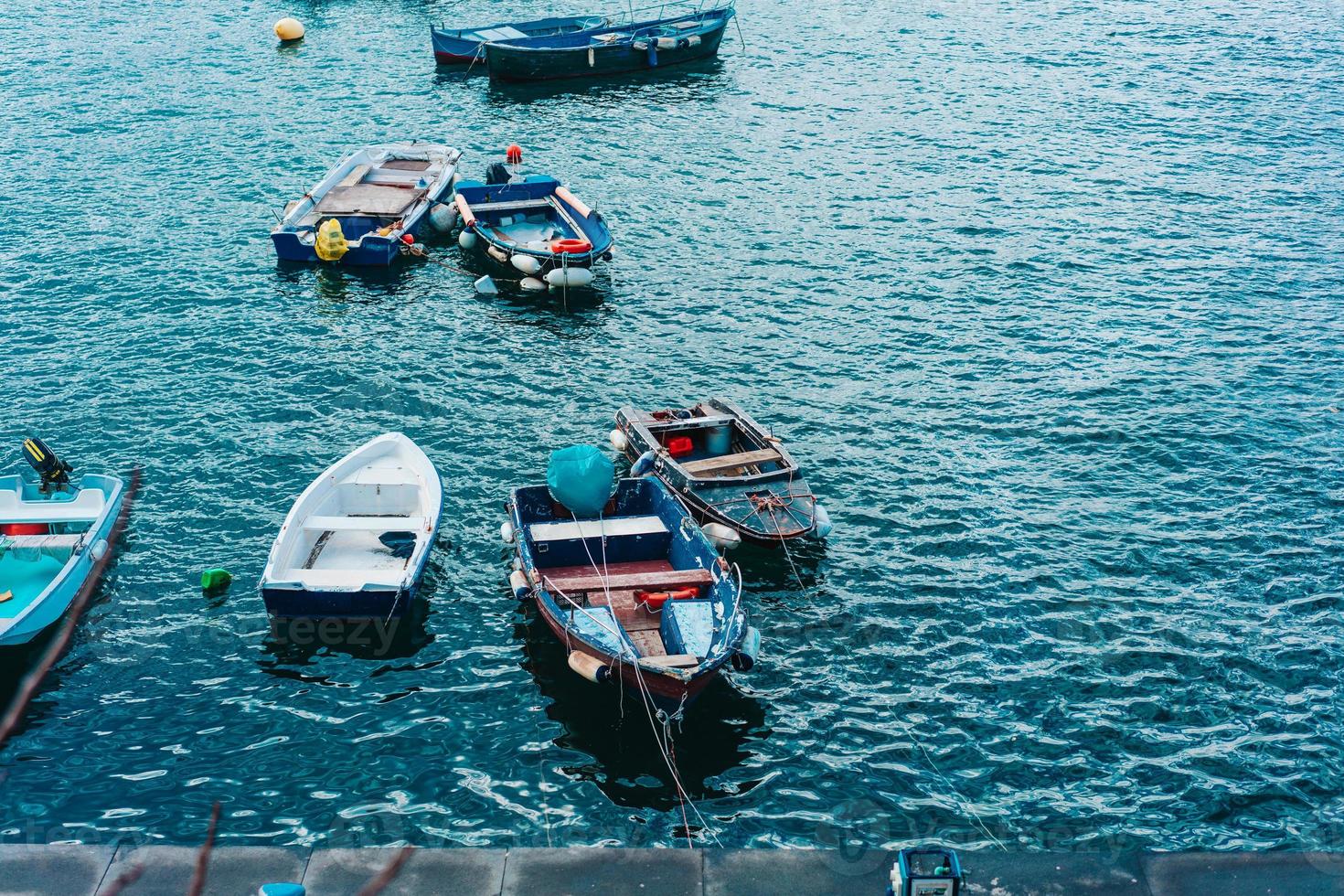 Berth with boats on sea shore photo
