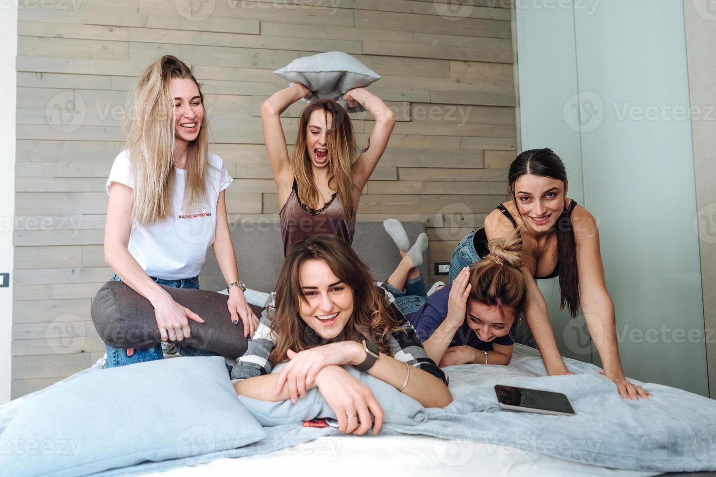 five girls on the bed in the bedroom photo