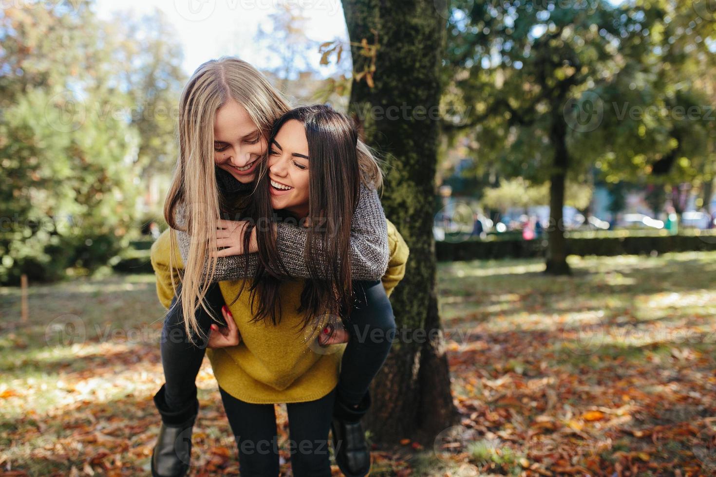 Two girls having fun in the park photo