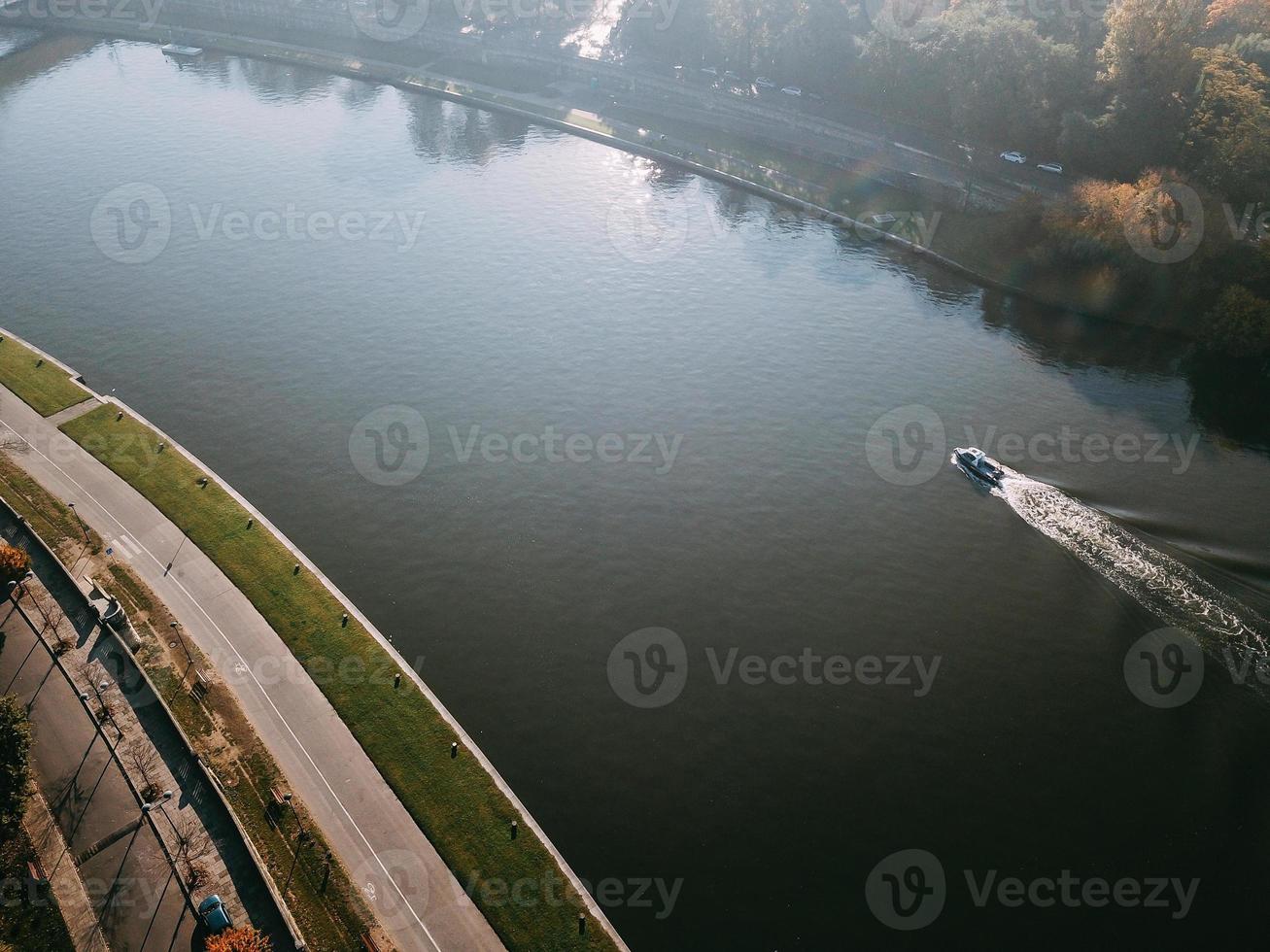 Motor boat floats down the river Wisla photo