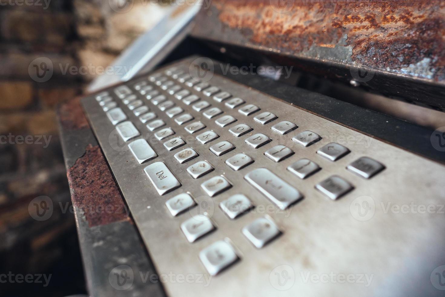 Very old computer, rusty keyboard with monitor photo