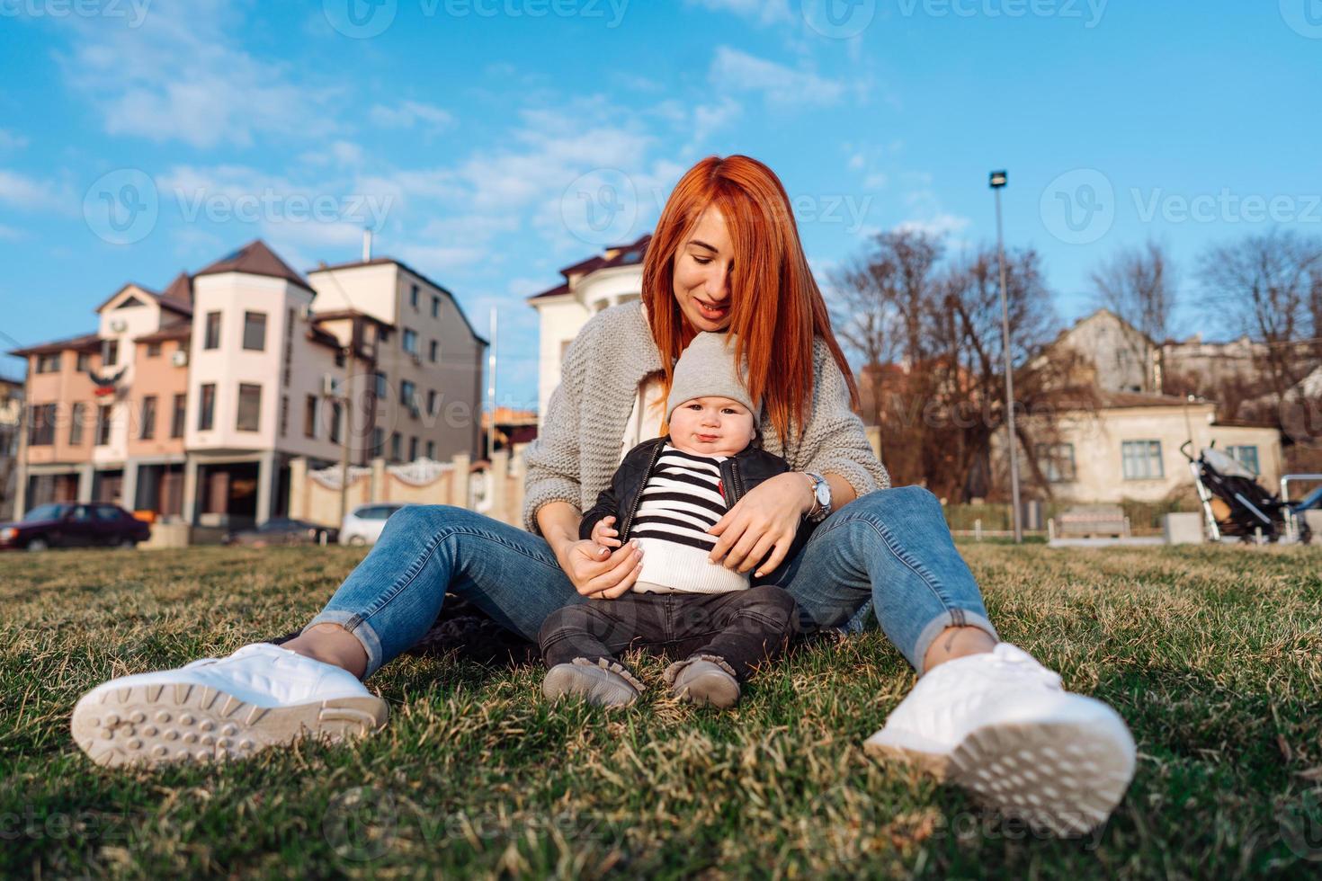 Mother and son on the grass photo