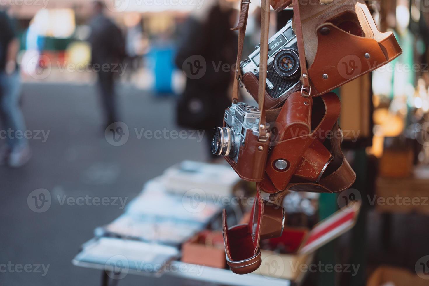 Old cameras are sold at a street market photo