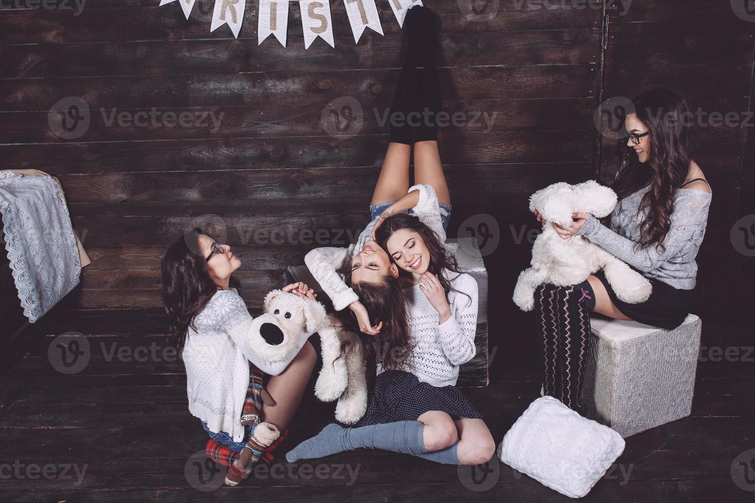 Four charming model posing on a vintage New Year's background photo