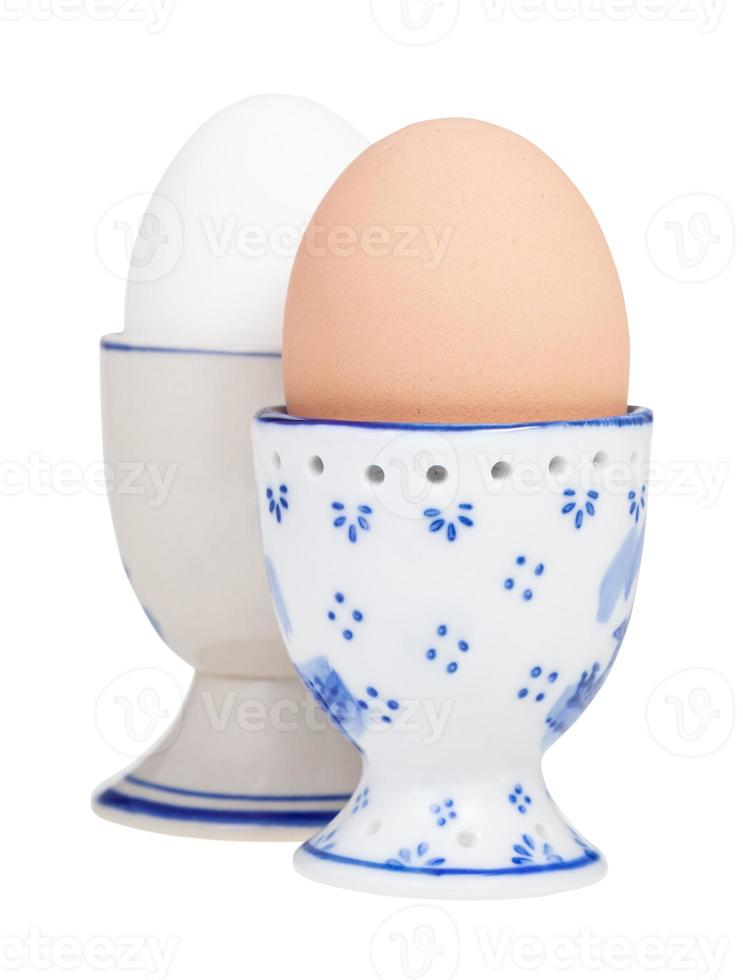 side view of brown and white boiled eggs in cups photo