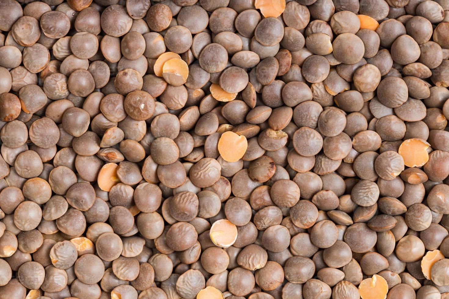 background - raw brown unhulled red lentils photo