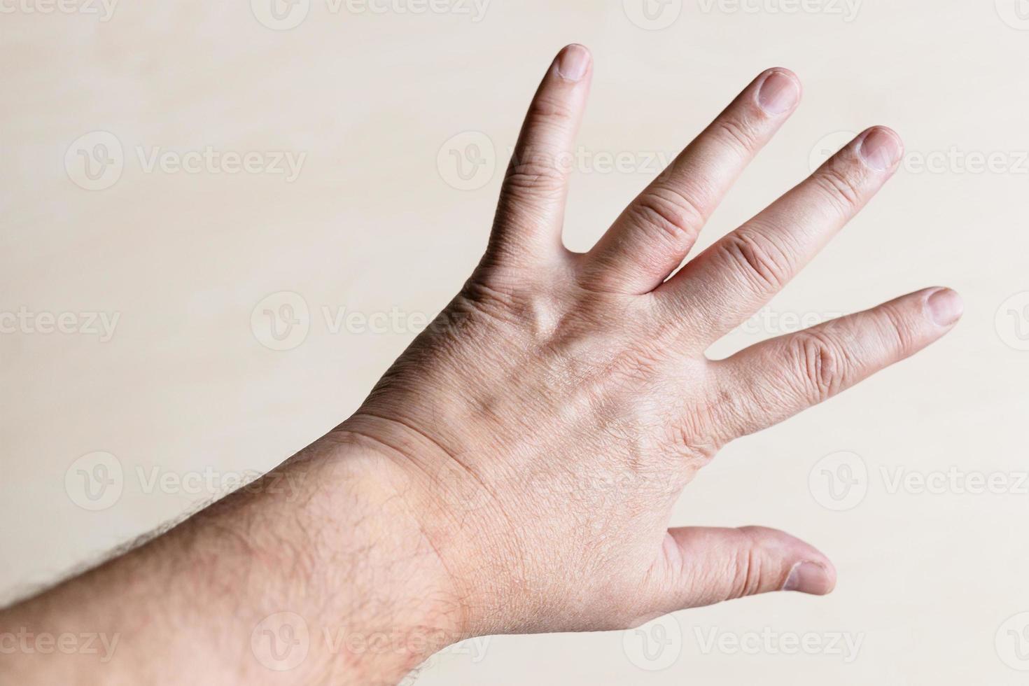 male back of hand with spread out five fingers photo