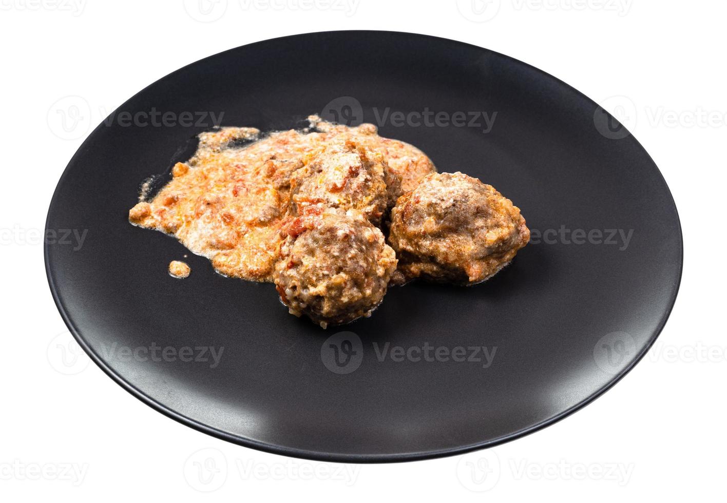 porción de albóndigas con arroz en plato aislado foto