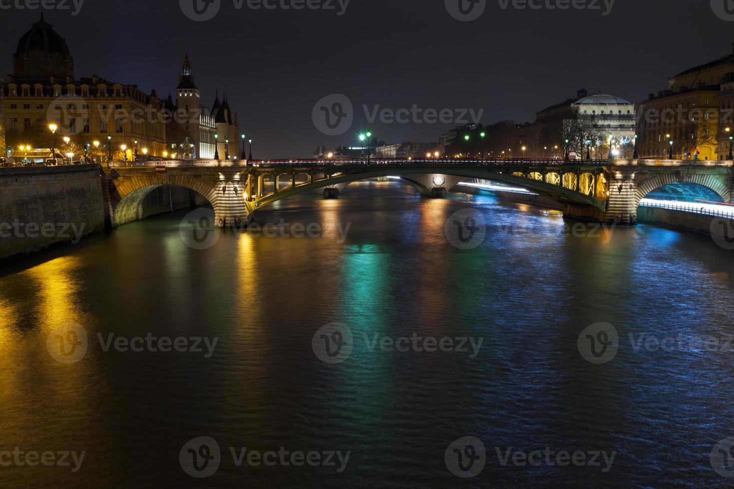 night panorama of Seine river in Paris photo