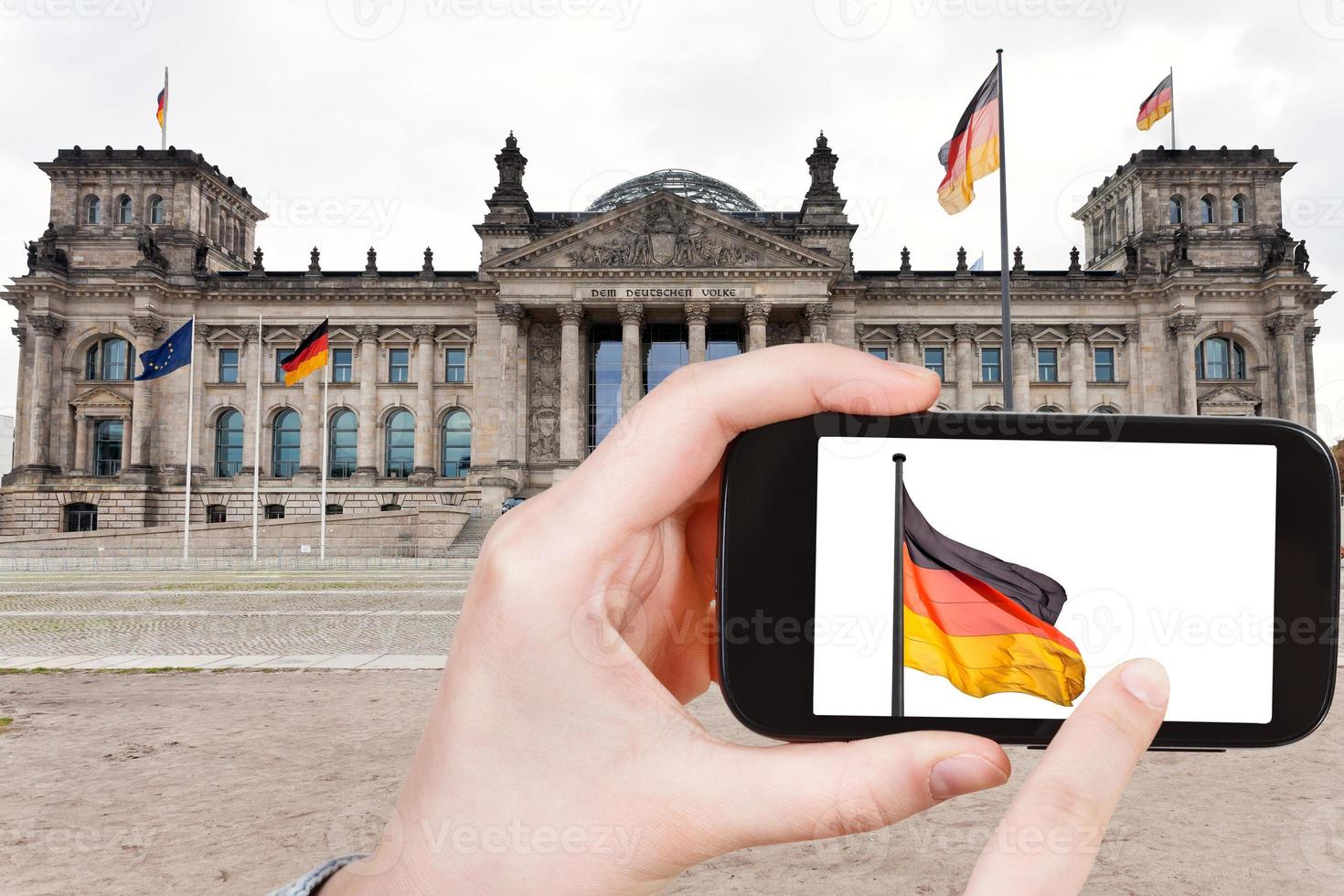 tourist taking photo of Reichstag Building